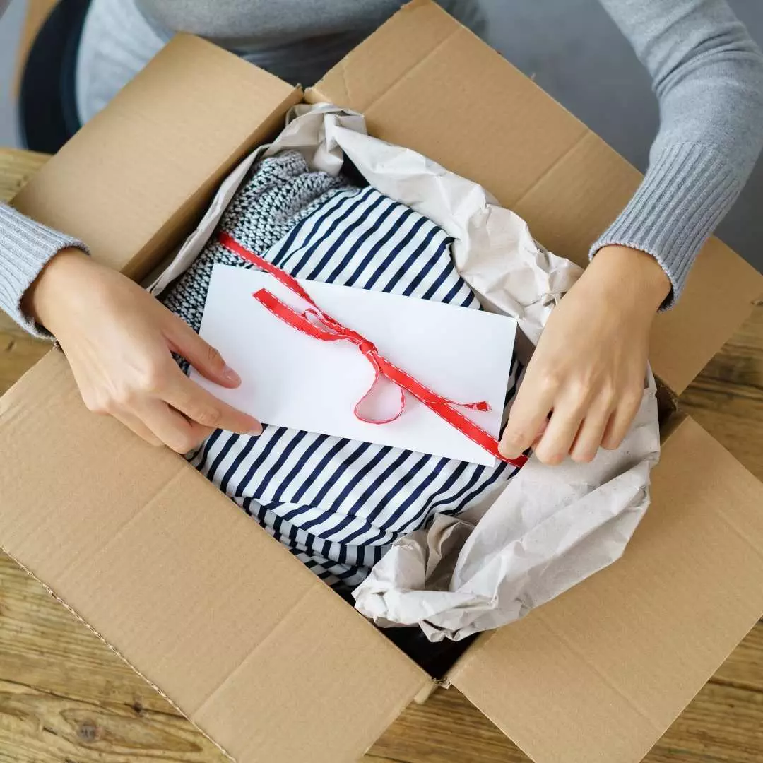 packing the clothes for shipment to the customer