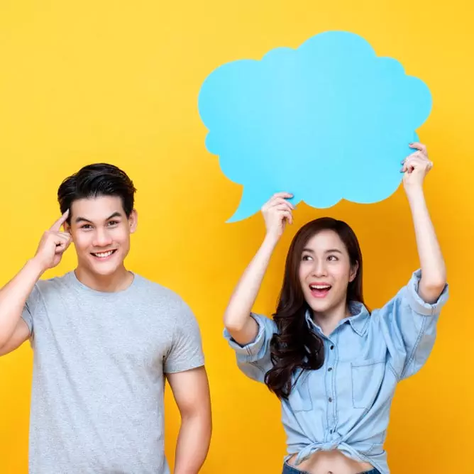 shutterstock_1304538400 boy with girl holding twitter cloud